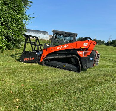 compact excavator preparing acreage for clearing