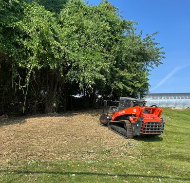 compact excavator preparing rough residential land